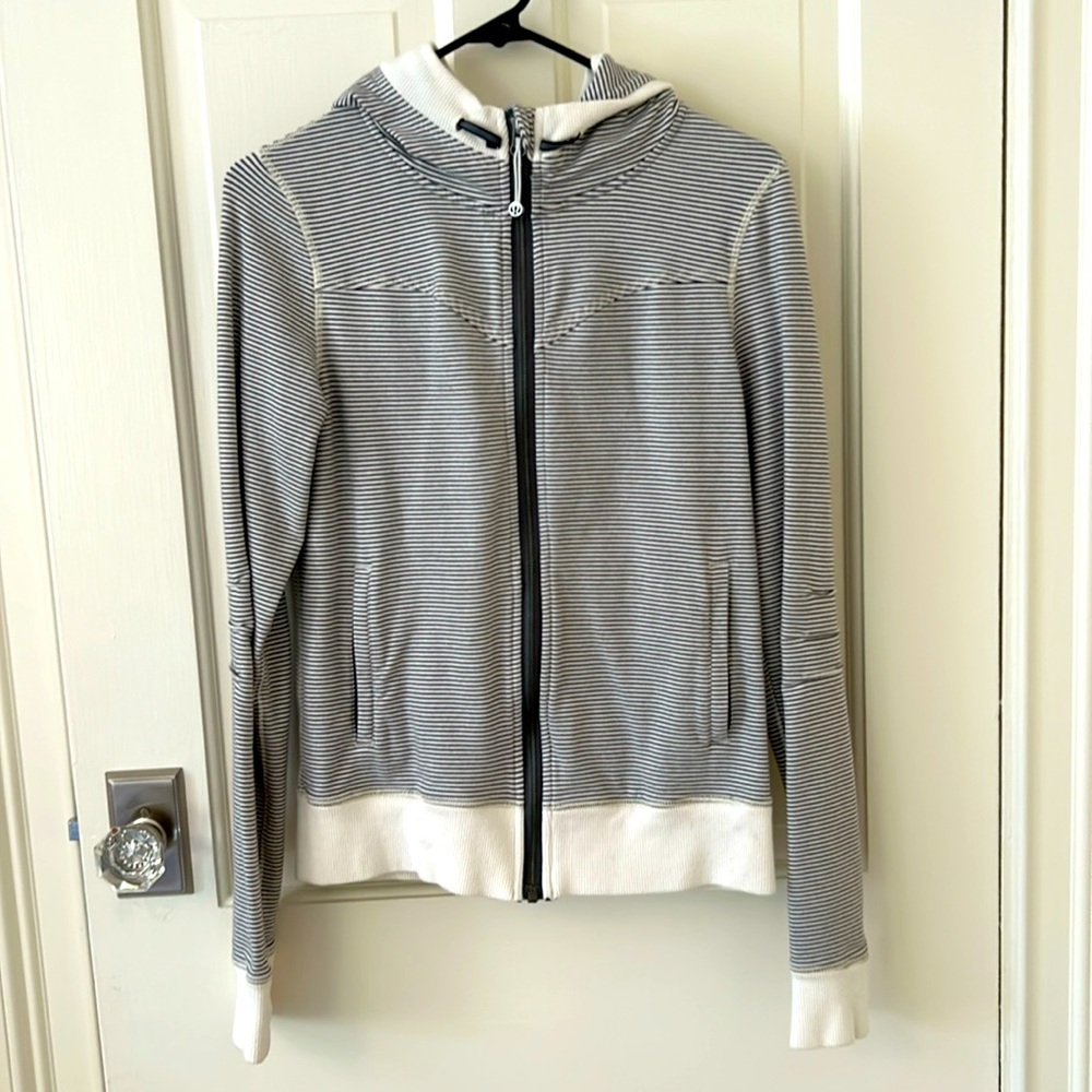 Lululemon zip-up, size 6. Full front zip closure and front pockets.